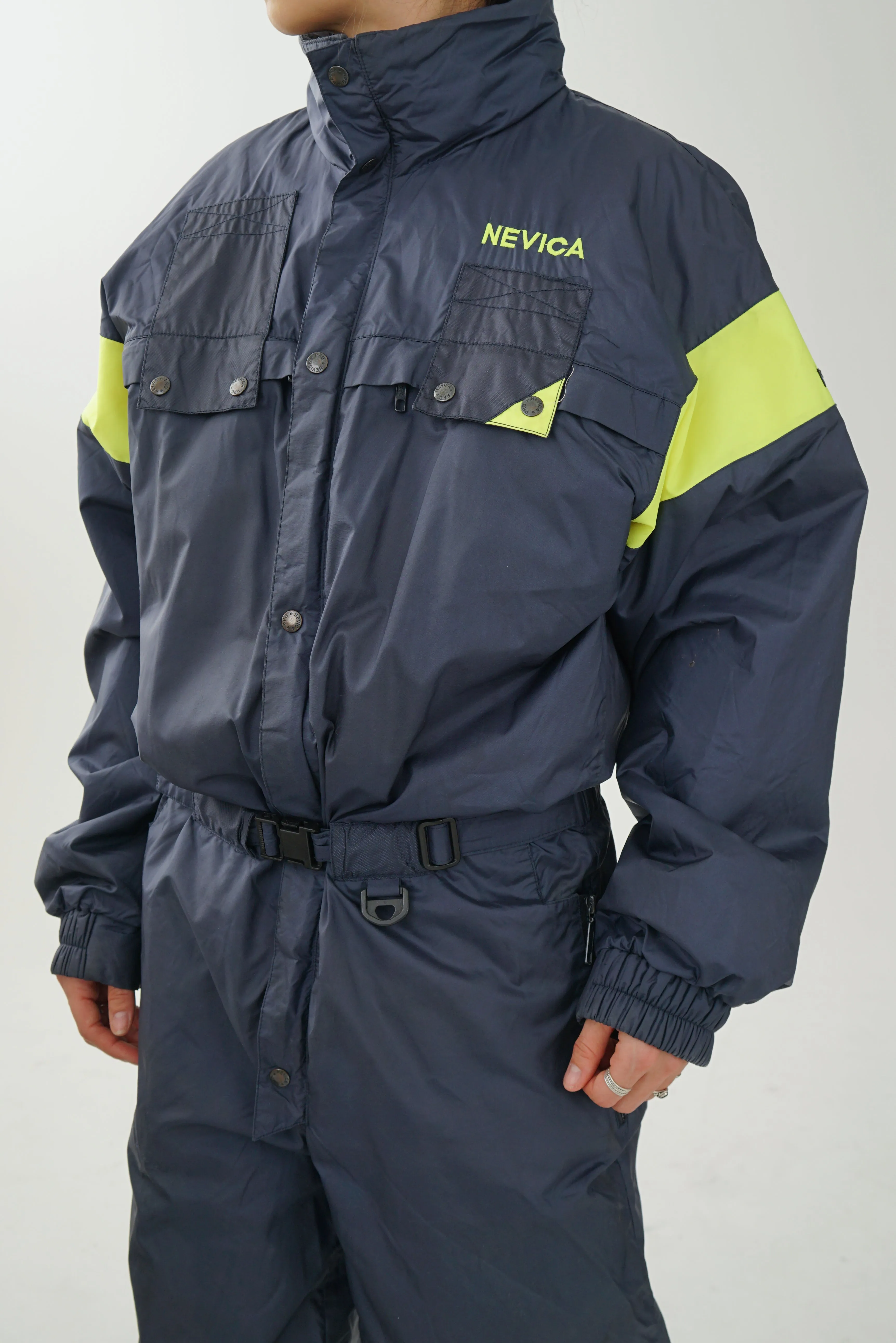 One piece vintage Nevica ski suit, snow suit bleu marin et jaune fluo pour homme taille 42 (M) tel quel